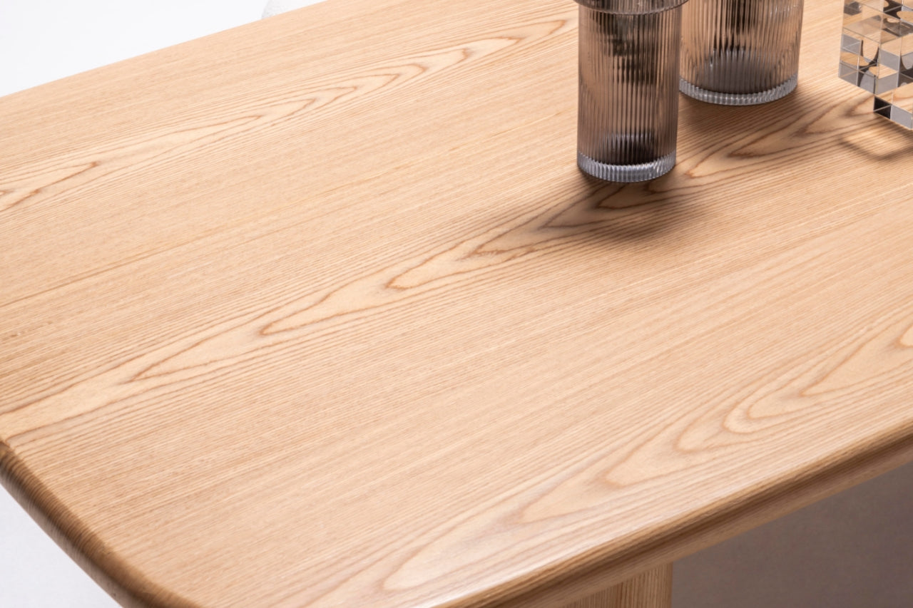 Side view of the Alva Dining Table showcasing its sleek lines and sturdy design.