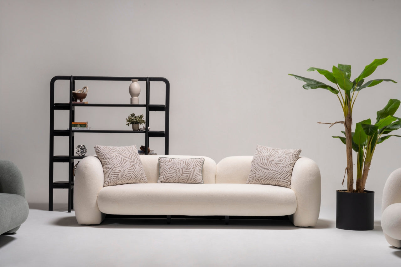 Side angle of the Alva Sofa, highlighting its sleek design and plush seating.