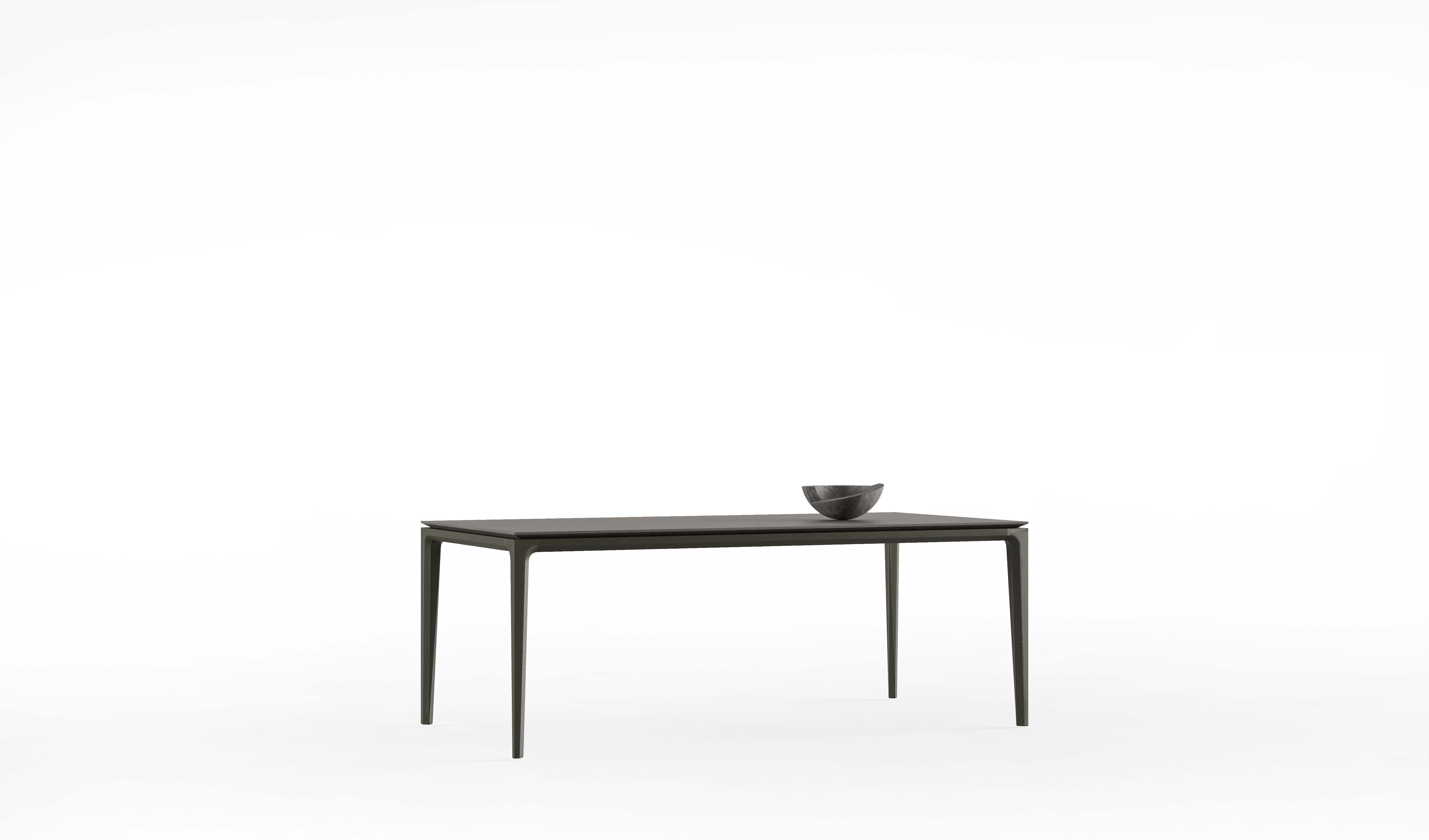 Side view of the Aurora Dining Table showcasing its clean lines and modern design.