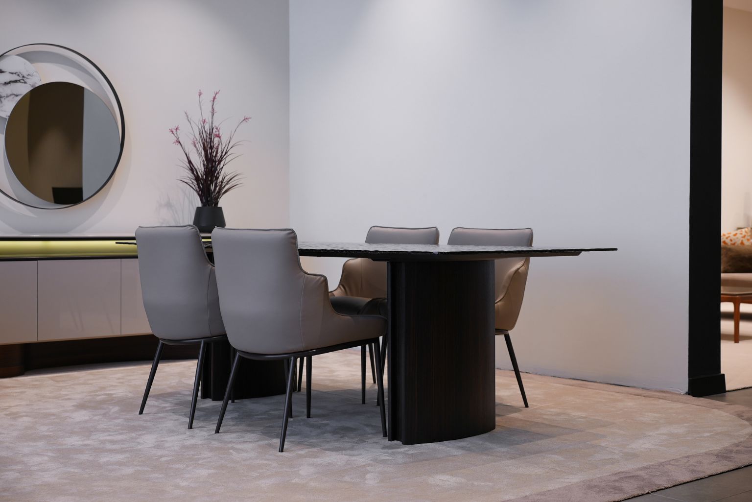 Flow Dining Table styled in a modern dining room with minimalist decor and elegant lighting.