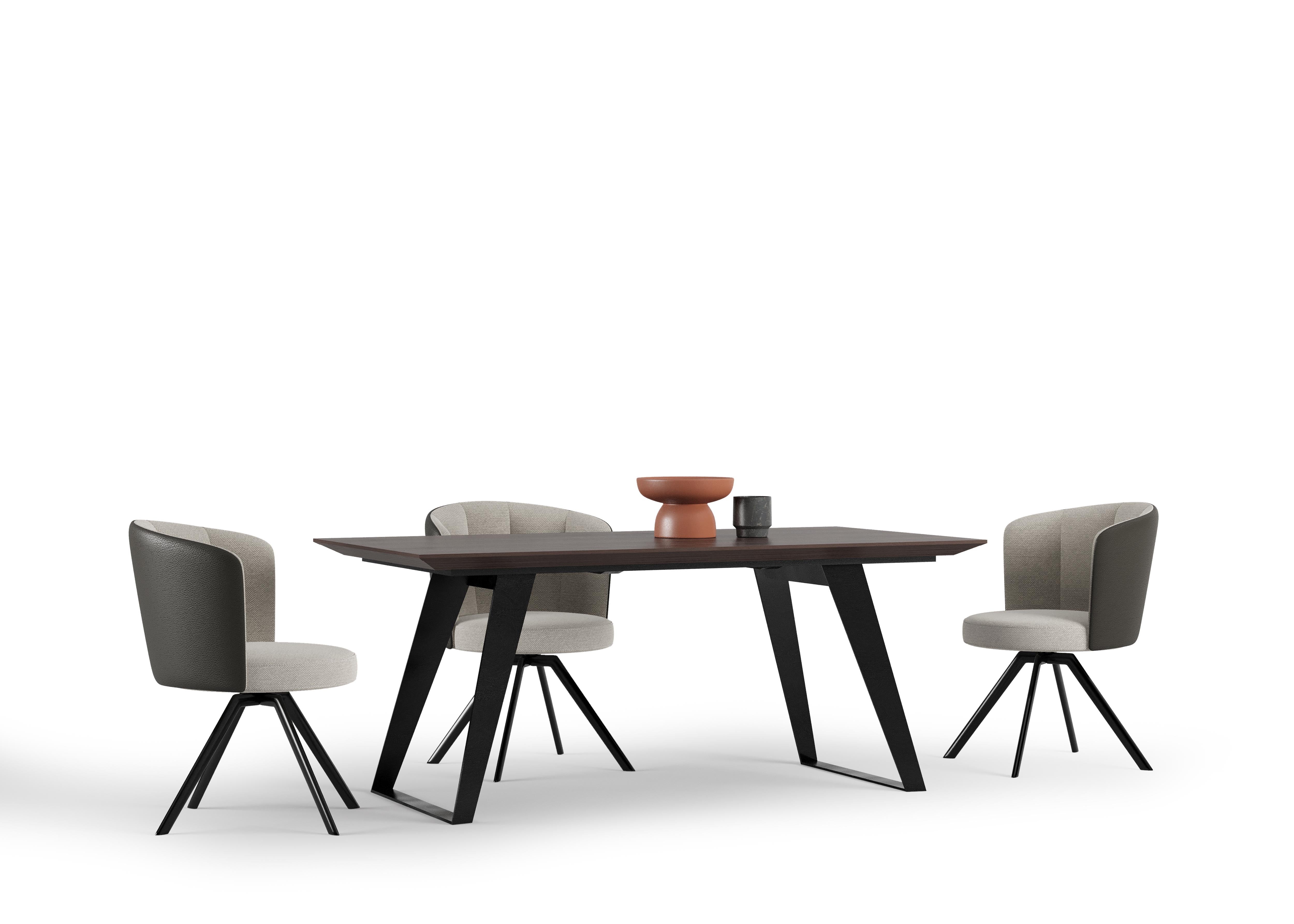 Back view of the Lupa Table emphasizing its clean lines and contemporary appeal.